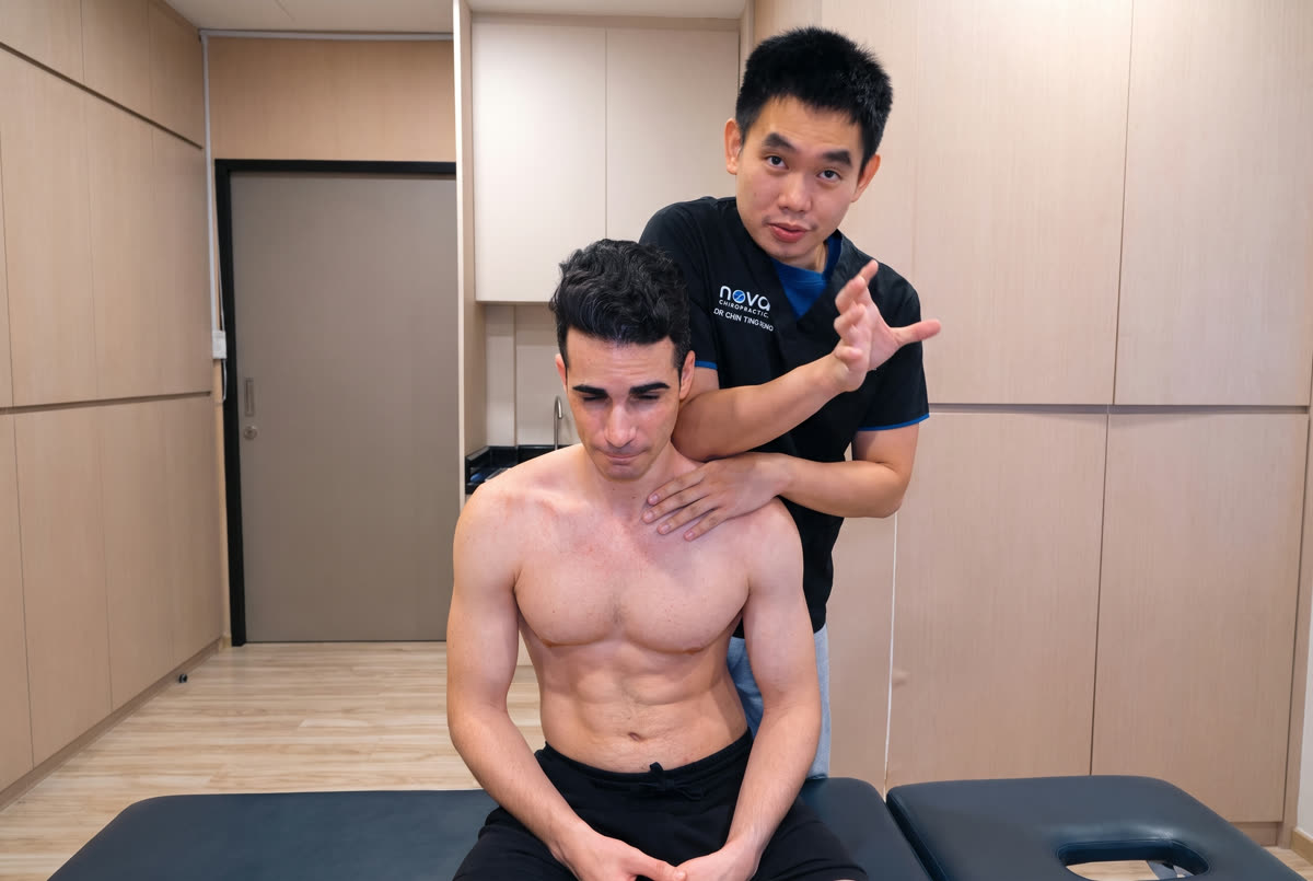 Chiropractor treating an international patient at Nova Chiropractic