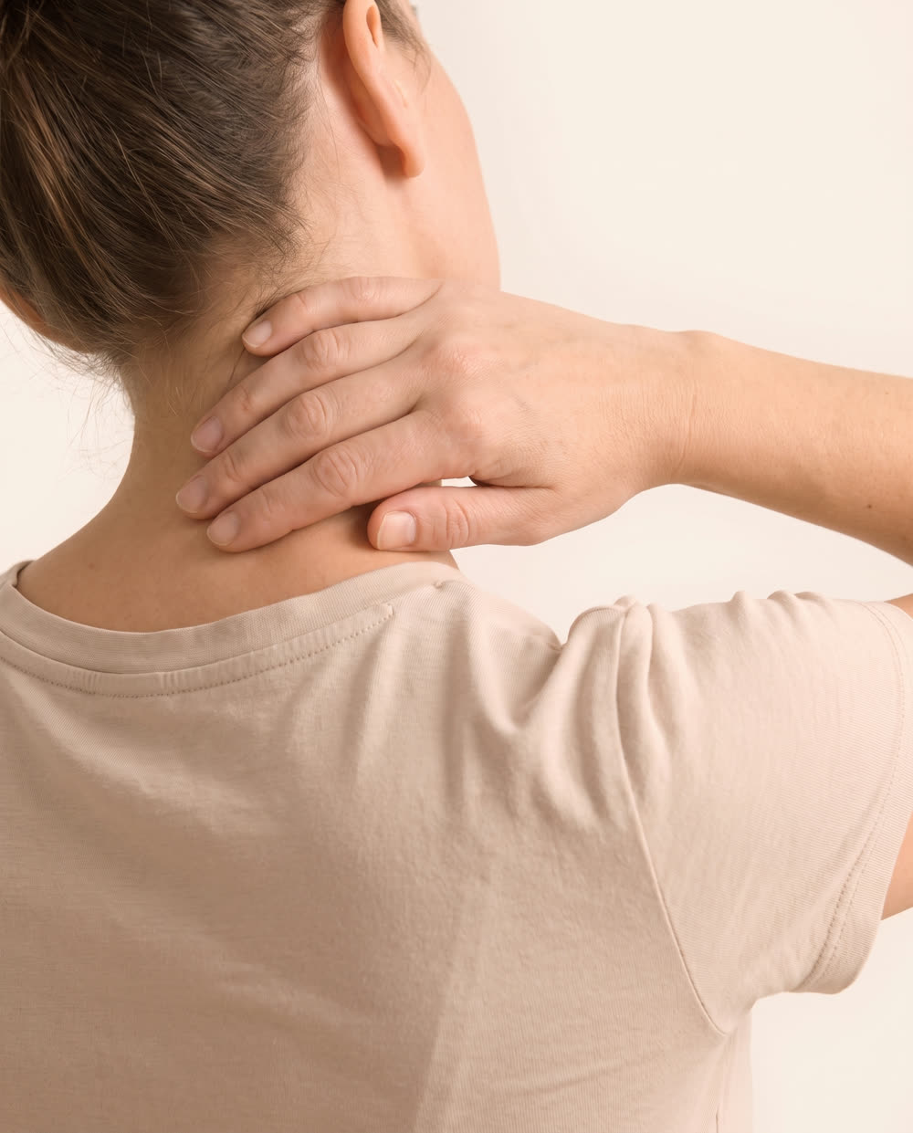 Person experiencing neck pain