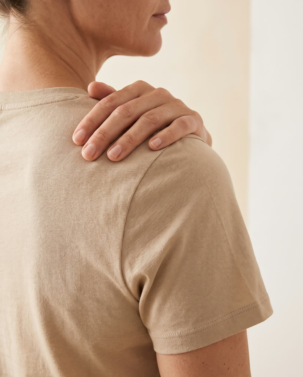 Person experiencing shoulder pain